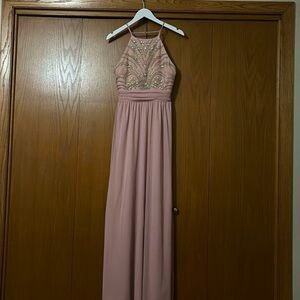 Blush colored prom dress with iridescent beading
